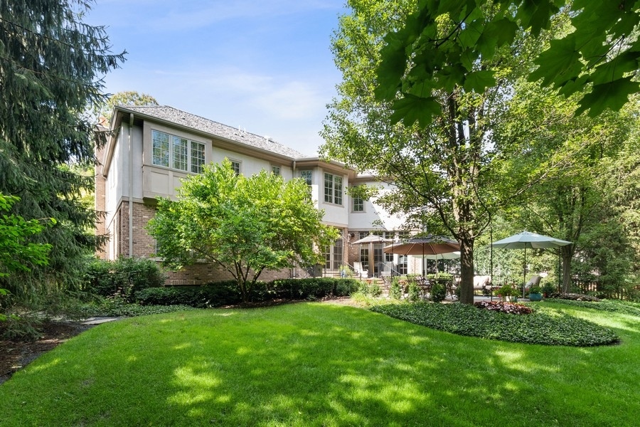 2239 Sheridan Road Highland Park, IL 60035 - Photo 44 of 46 a front view of a house with a garden