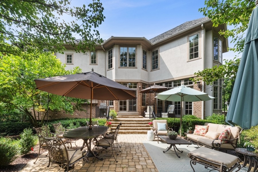 2239 Sheridan Road Highland Park, IL 60035 - Photo 45 of 46 a front view of a house with porch and garden