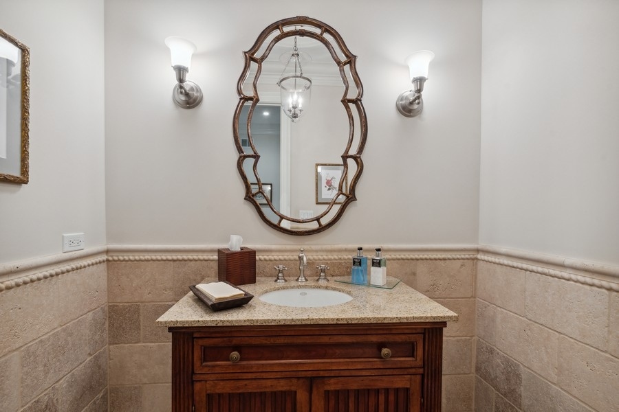 2239 Sheridan Road Highland Park, IL 60035 - Photo 6 of 46 a bathroom with a sink and a mirror