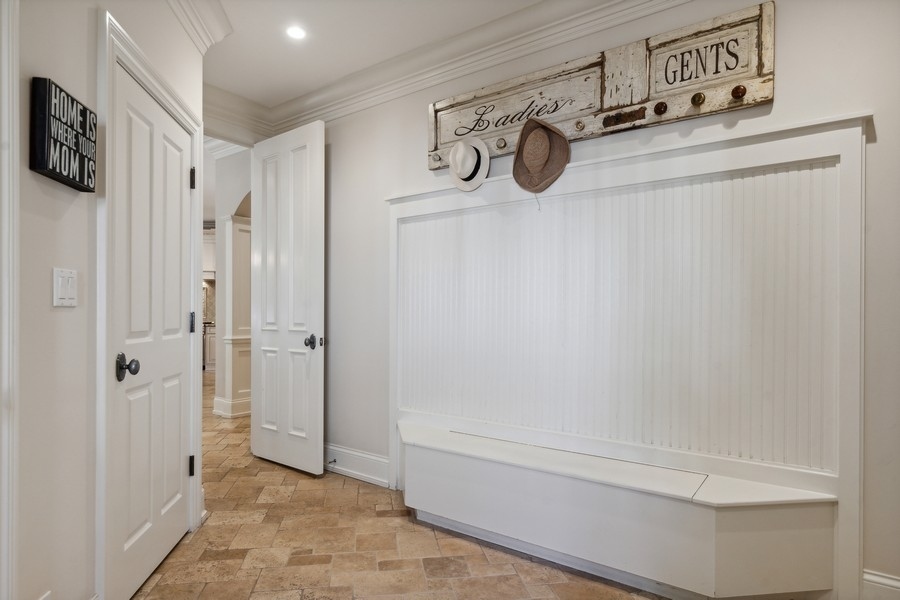 2239 Sheridan Road Highland Park, IL 60035 - Photo 8 of 46 a bathroom with a tub shower and mirror