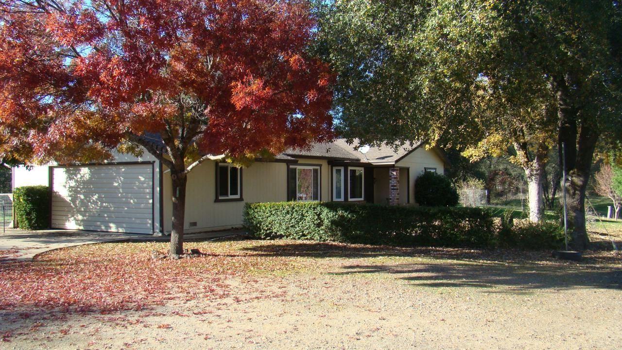 6564 Oak Bottom Road Anderson, CA 96007 - Photo 1 of 1 a front view of a house with a yard