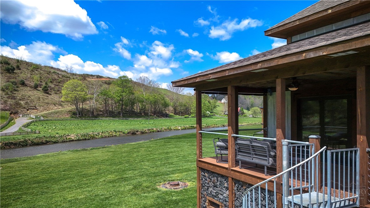 972 West Deep Ford Road Warrensville, NC 28693 - Photo 27 of 36 a view of a deck with a big yard