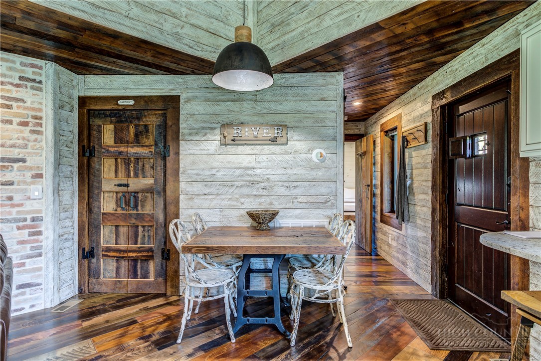 972 West Deep Ford Road Warrensville, NC 28693 - Photo 7 of 36 a dining room with furniture and wooden floor