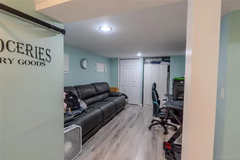 a living room with furniture with wooden floor