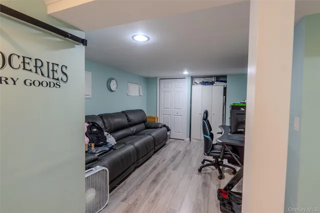 a living room with furniture with wooden floor