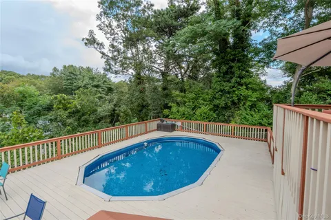 a view of a swimming pool with a balcony