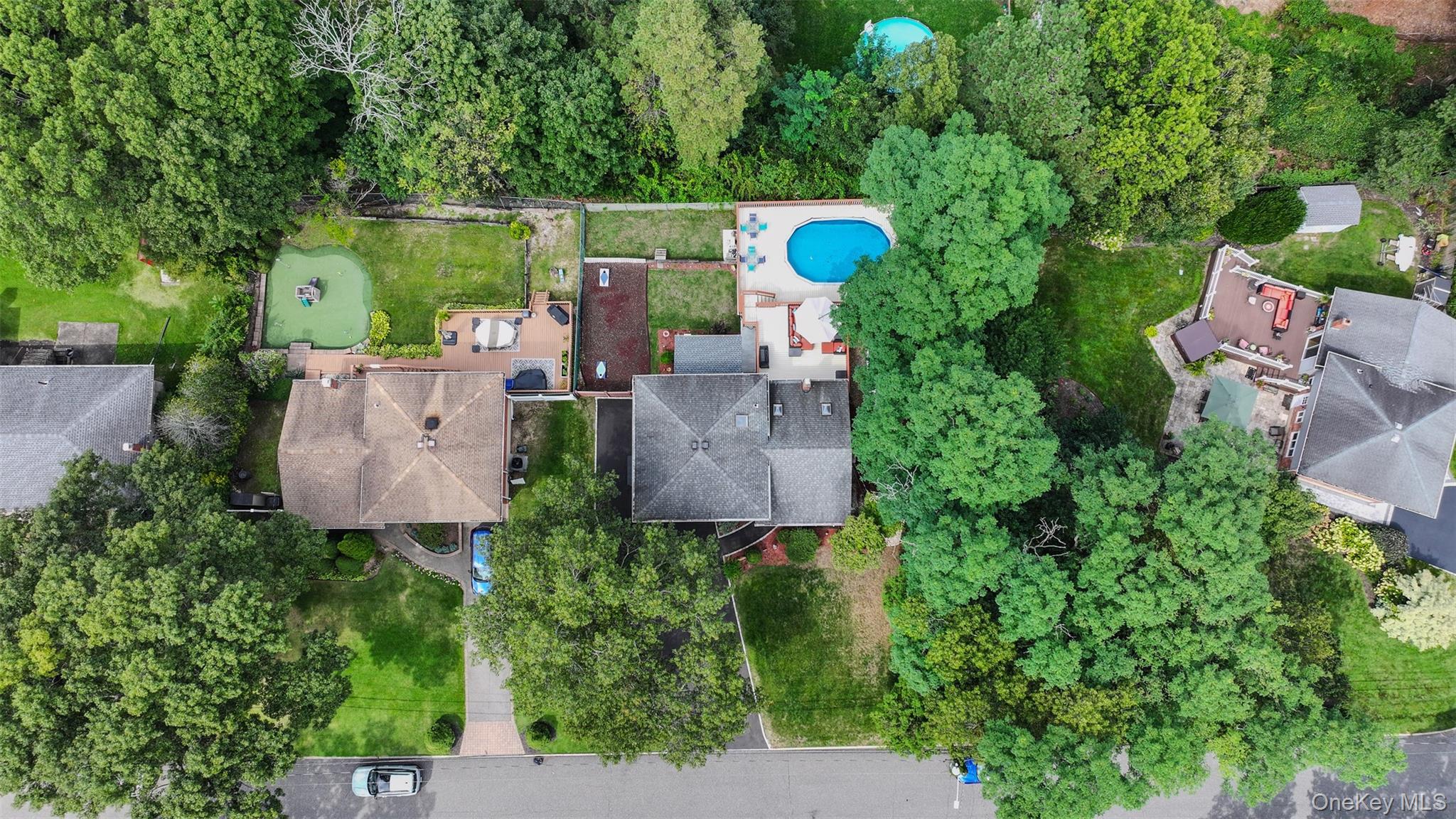 45 Harvard Lane Commack, NY 11725 - Photo 18 of 19 an aerial view of a house with outdoor space and street view