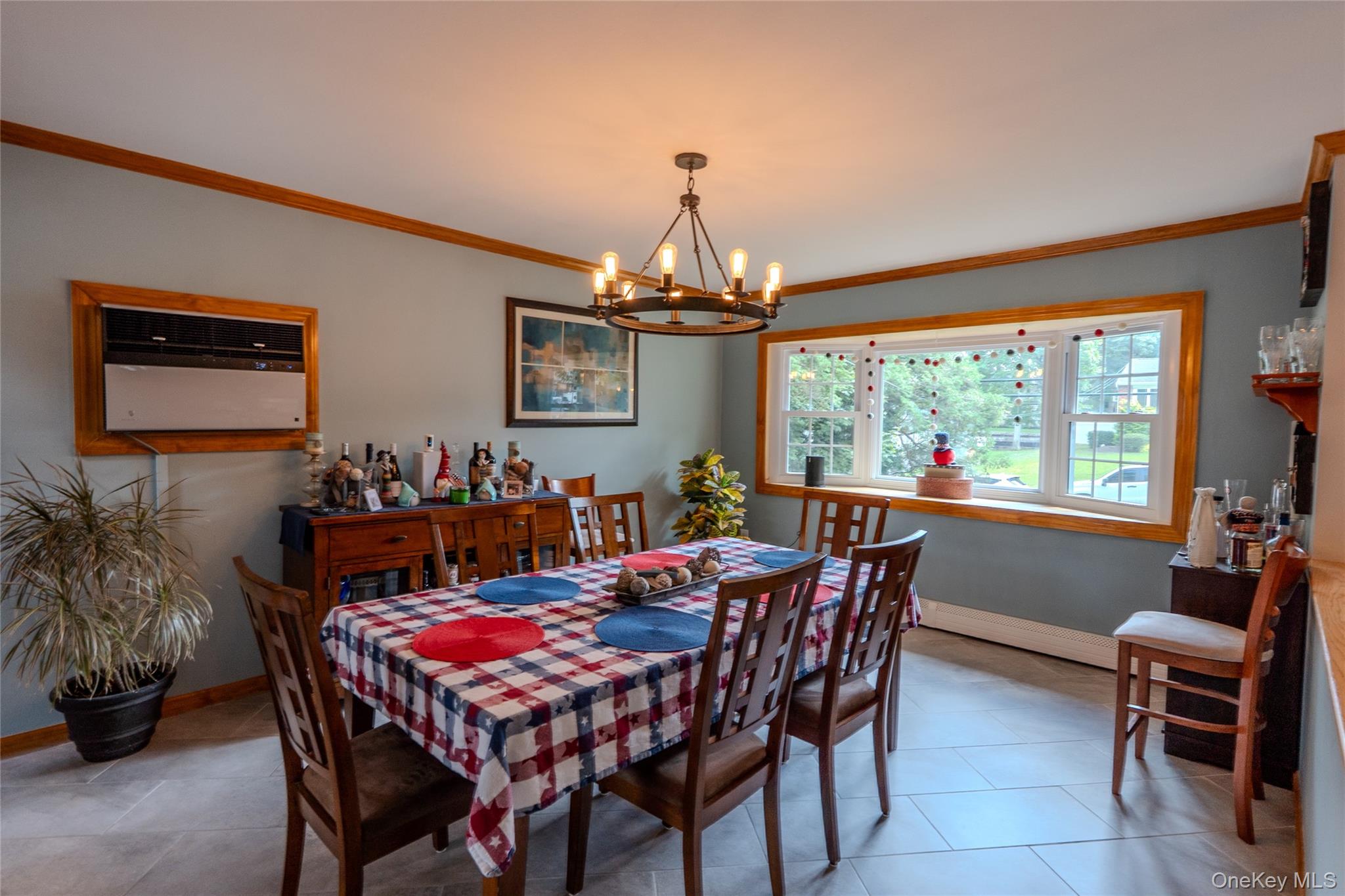 45 Harvard Lane Commack, NY 11725 - Photo 9 of 19 a dining room with furniture a chandelier and window