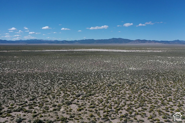350 West Antelope Springs Road Beryl, UT 84714 - Photo 11 of 14 Expansive desert landscape with natural vegetation, distant mountain ranges, and clear skies