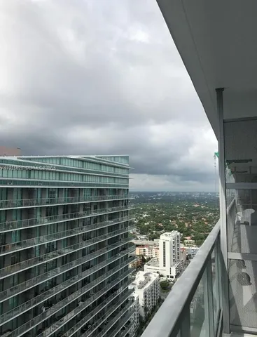 a view of a balcony with city view