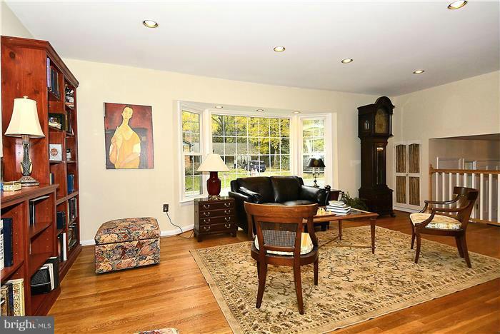9512 Clement Road Silver Spring, MD 20910 - Photo 3 of 14 a living room with furniture and a floor to ceiling window