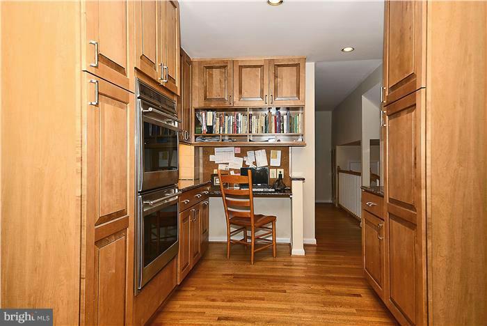 9512 Clement Road Silver Spring, MD 20910 - Photo 6 of 14 a kitchen with stainless steel appliances granite countertop a refrigerator and a stove top oven