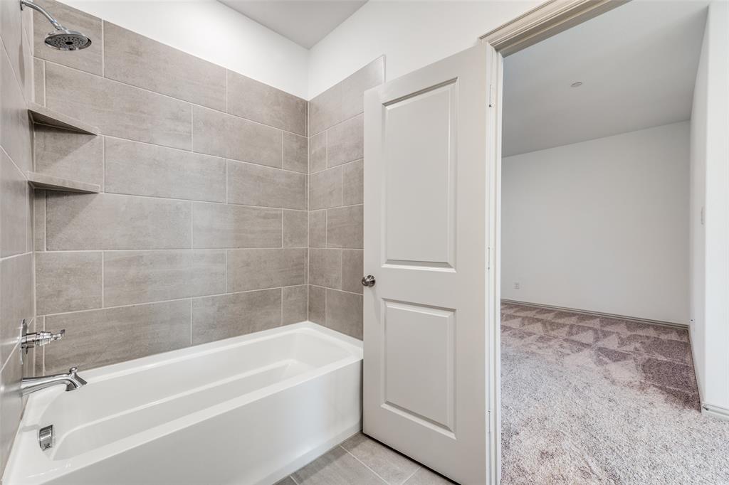 15866 Yellow Elder Road Frisco, TX 75035 - Photo 21 of 25 a bathroom with a bathtub