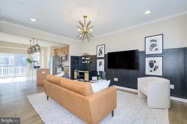 a kitchen with stainless steel appliances granite countertop a refrigerator a stove top oven a sink and dishwasher