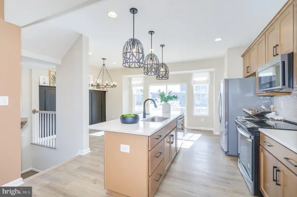 a view of a kitchen and dining room