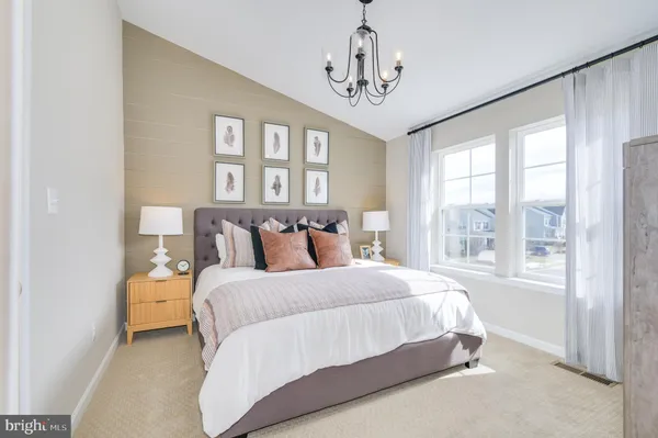a bedroom with a bed and wall painting