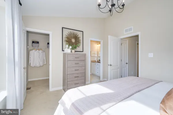 a bedroom with bed and a window