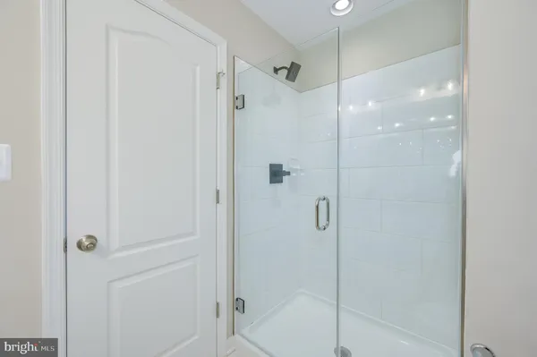 a view of a balcony with wooden floor and fence