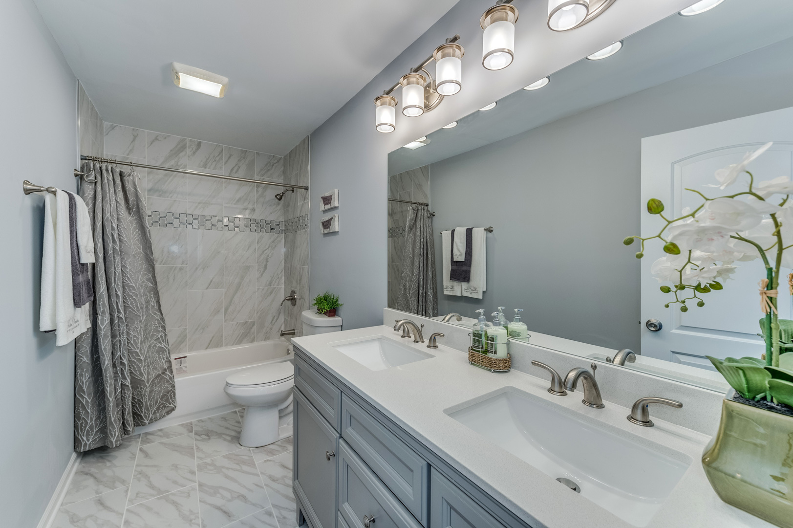 2309 Beck Road Lindenhurst, IL 60046 - Photo 14 of 28 a bathroom with a double vanity sink toilet and shower
