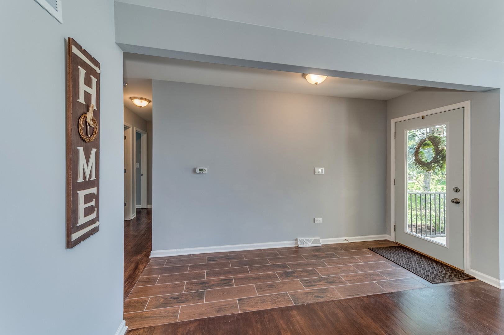 2309 Beck Road Lindenhurst, IL 60046 - Photo 3 of 28 wooden floor in an empty room with a window