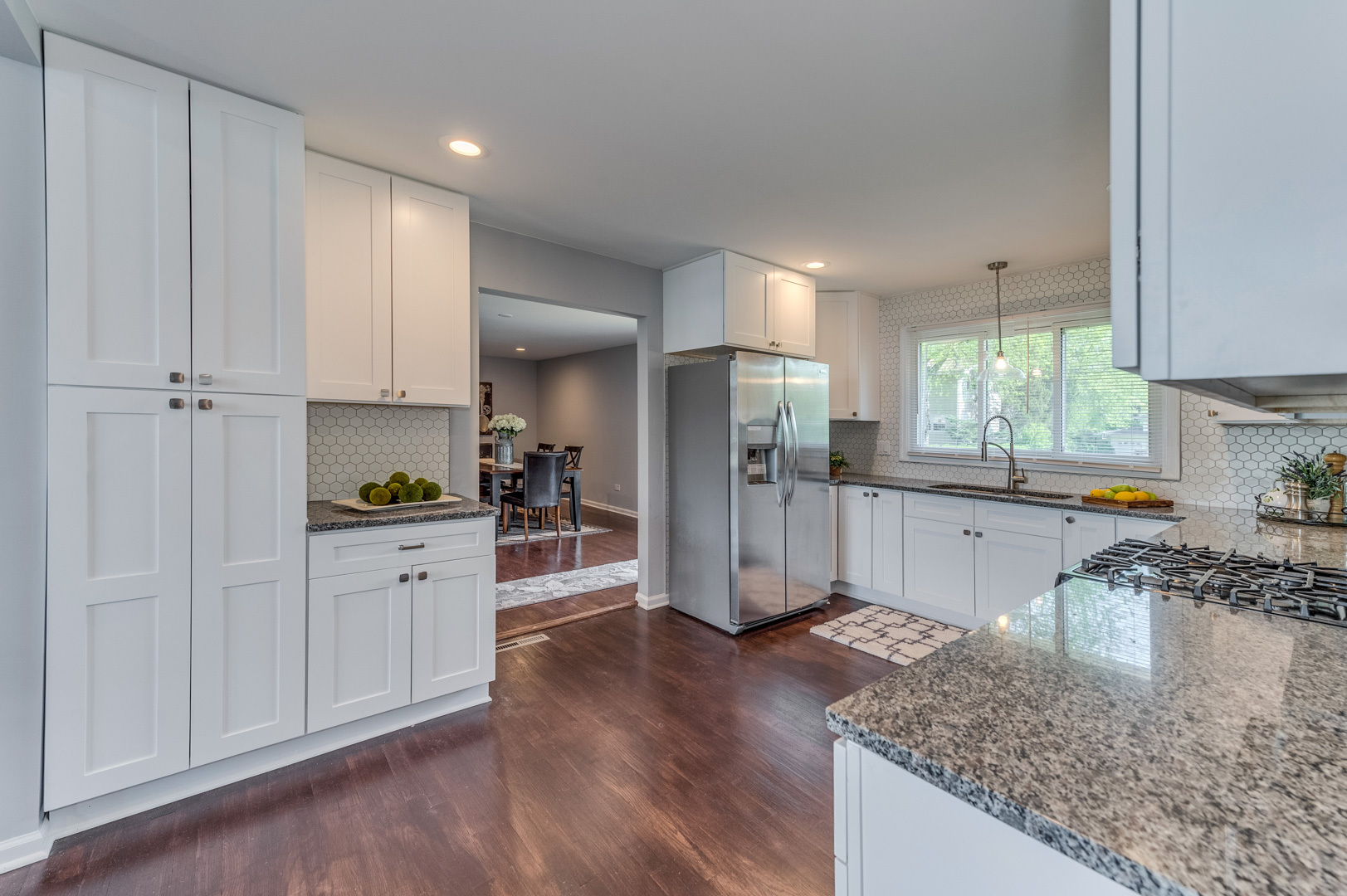 2309 Beck Road Lindenhurst, IL 60046 - Photo 8 of 28 a kitchen with stainless steel appliances granite countertop a refrigerator sink and cabinets