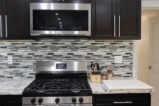 a kitchen with sink and stove