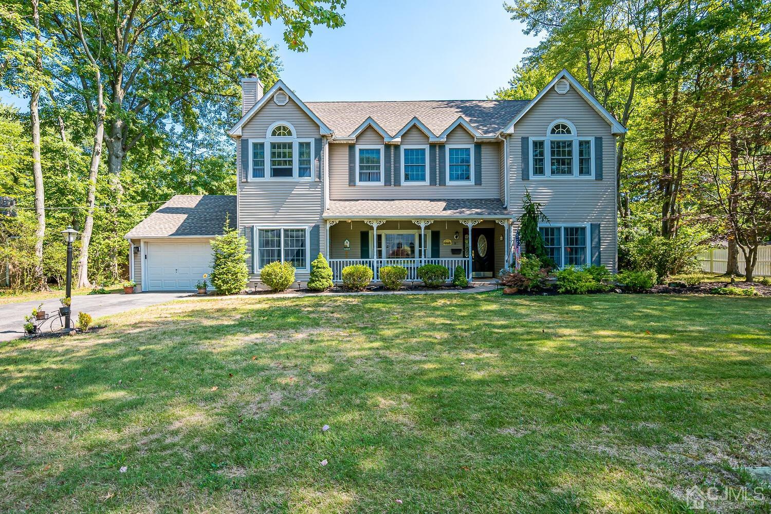 27 Homestead Road Edison, NJ 08820 - Photo 2 of 64 a front view of a house with a garden