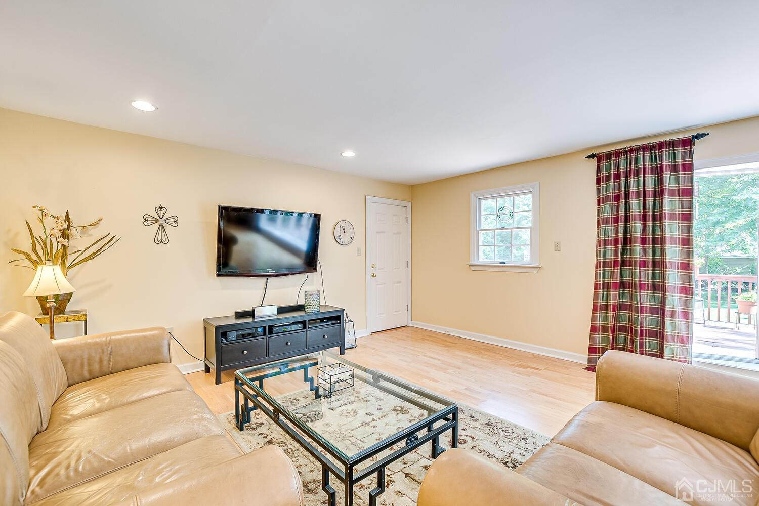 27 Homestead Road Edison, NJ 08820 - Photo 29 of 64 a living room with furniture and a flat screen tv