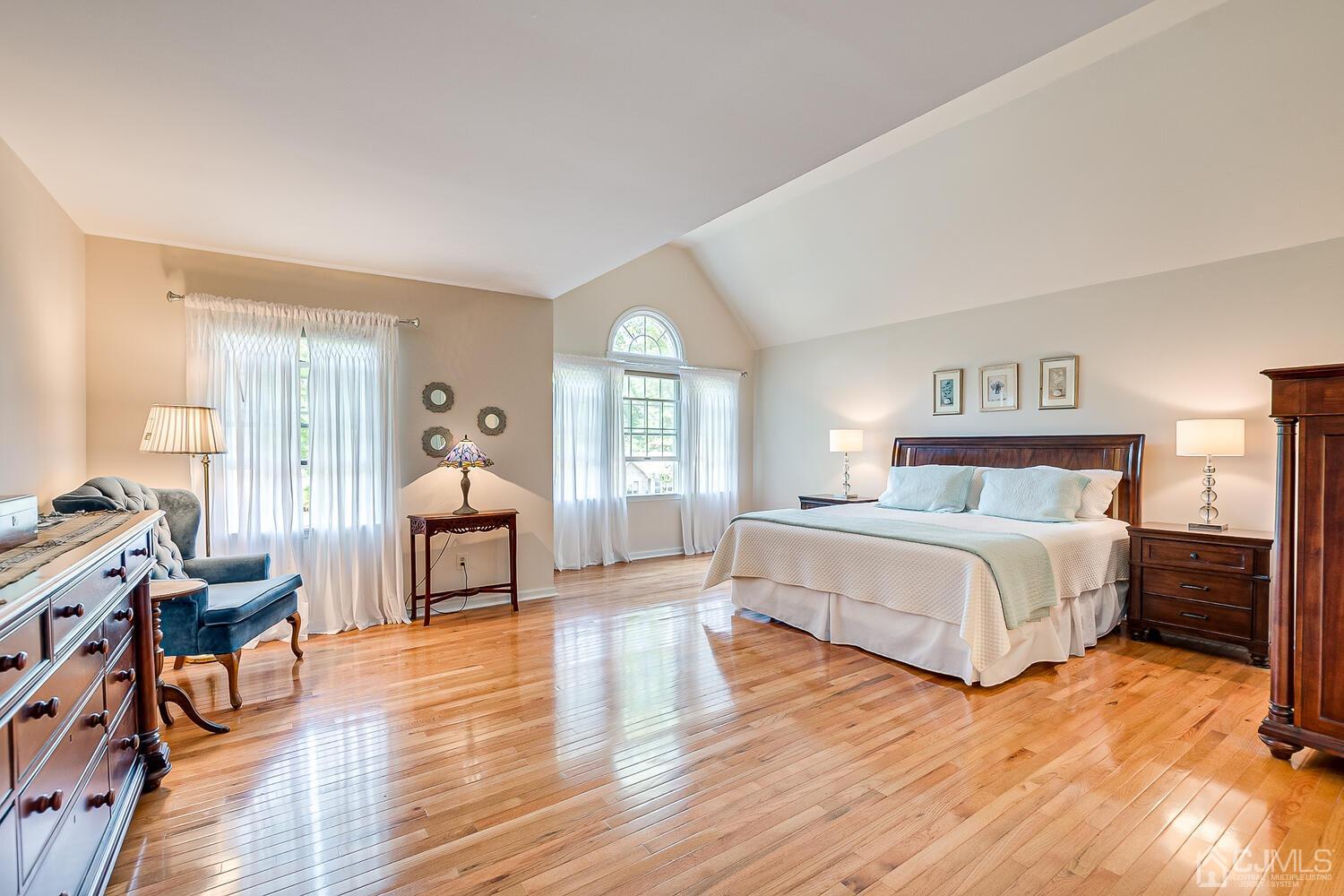27 Homestead Road Edison, NJ 08820 - Photo 38 of 64 a spacious bedroom with a bed a table and chair