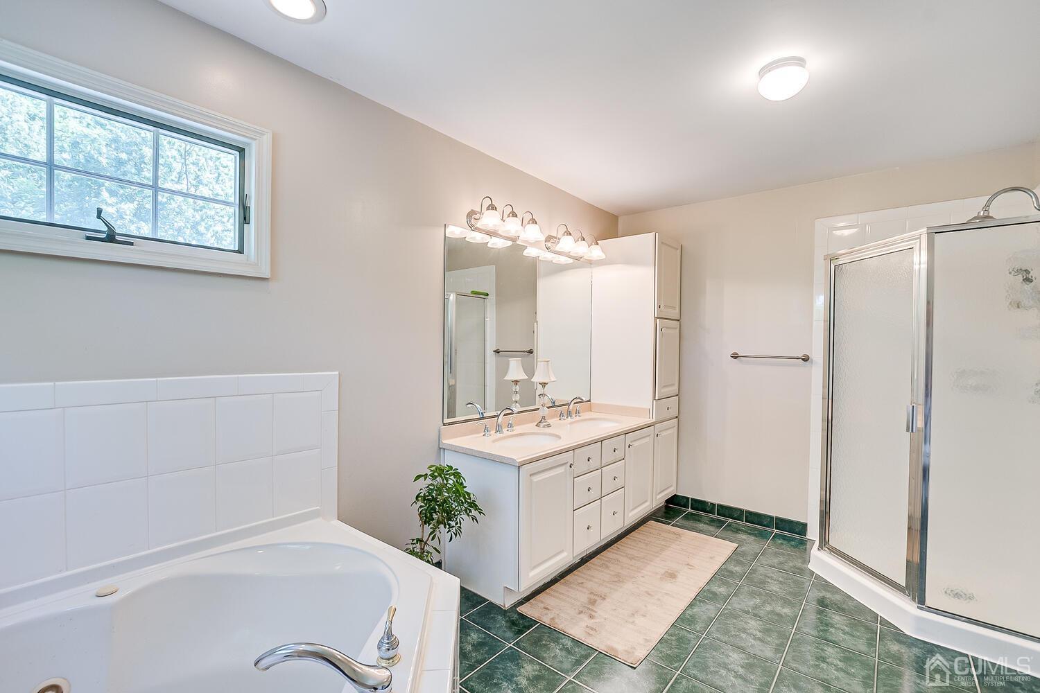 27 Homestead Road Edison, NJ 08820 - Photo 43 of 64 a spacious bathroom with a double vanity sink a mirror and a shower
