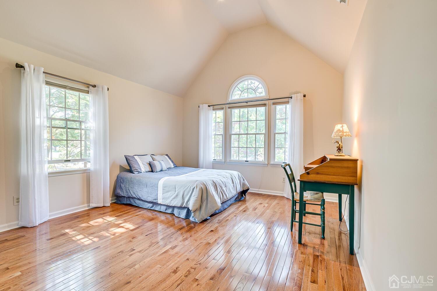 27 Homestead Road Edison, NJ 08820 - Photo 47 of 64 a bedroom with a bed and wooden floor