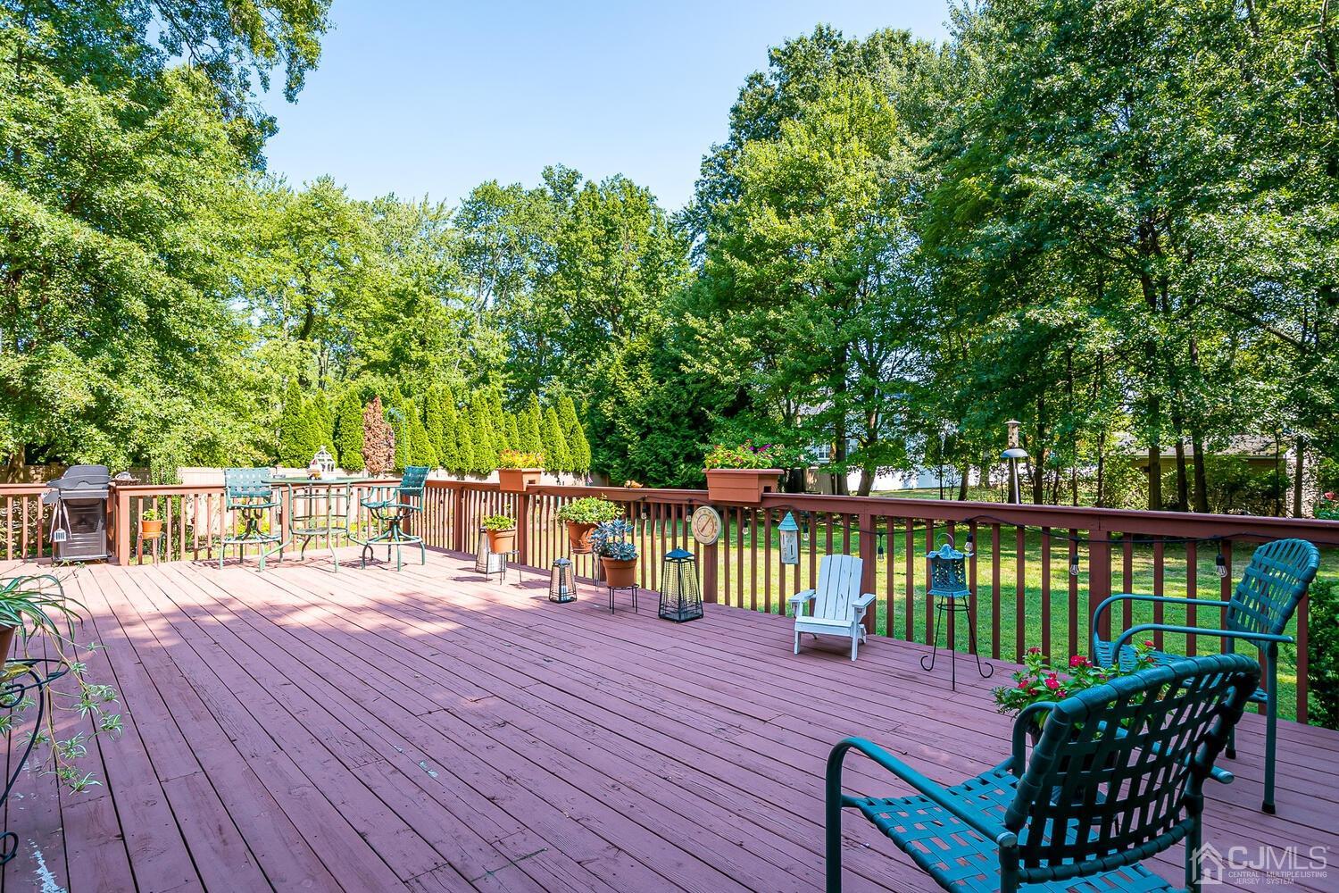27 Homestead Road Edison, NJ 08820 - Photo 54 of 64 a view of a deck with two chair and wooden floor