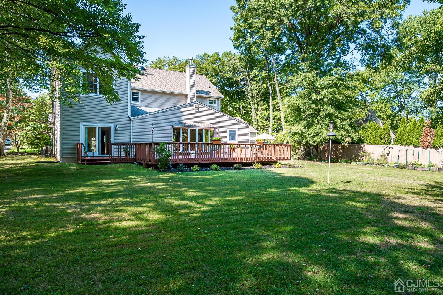 27 Homestead Road Edison, NJ 08820 - Photo 57 of 64 a view of a house with a big yard and large trees