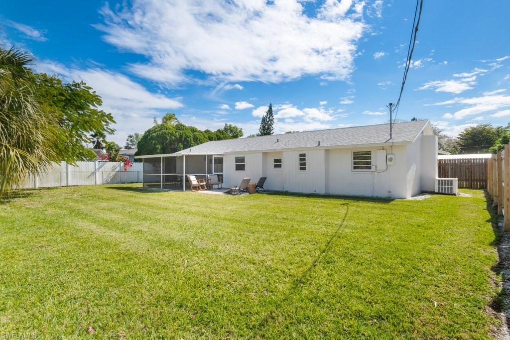 1207 Hernando Street Naples, FL 34103 - Photo 35 of 37 a view of a house with a backyard