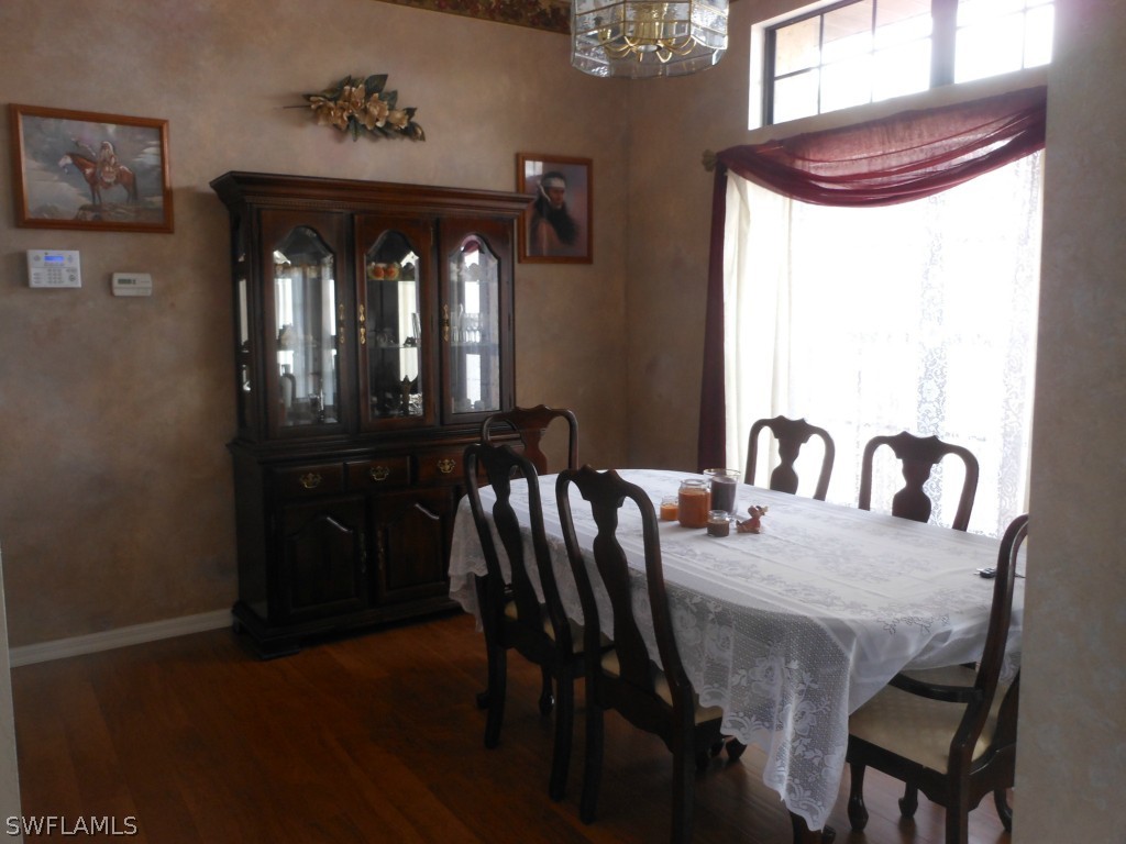 17560 Homewood Road Fort Myers, FL 33967 - Photo 2 of 9 a view of a dining room with furniture and window