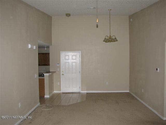 7920 Merrill Road, Unit 1816 Jacksonville, FL 32277 - Photo 3 of 10 a view of empty room with a fireplace