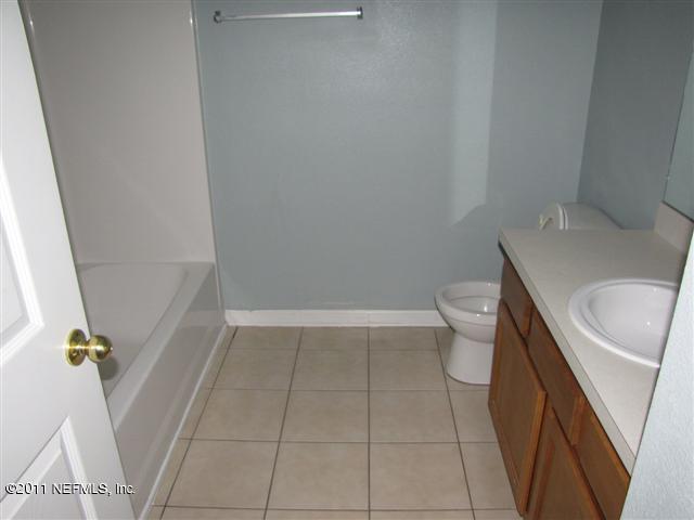7920 Merrill Road, Unit 1816 Jacksonville, FL 32277 - Photo 9 of 10 a bathroom with a sink and toilet