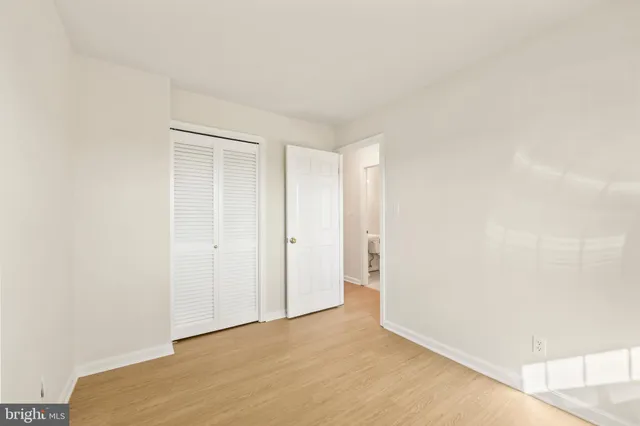 a view of a livingroom with a fireplace and cabinet
