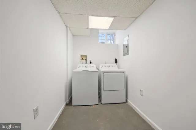 a view of a wooden chairs and table in the yard