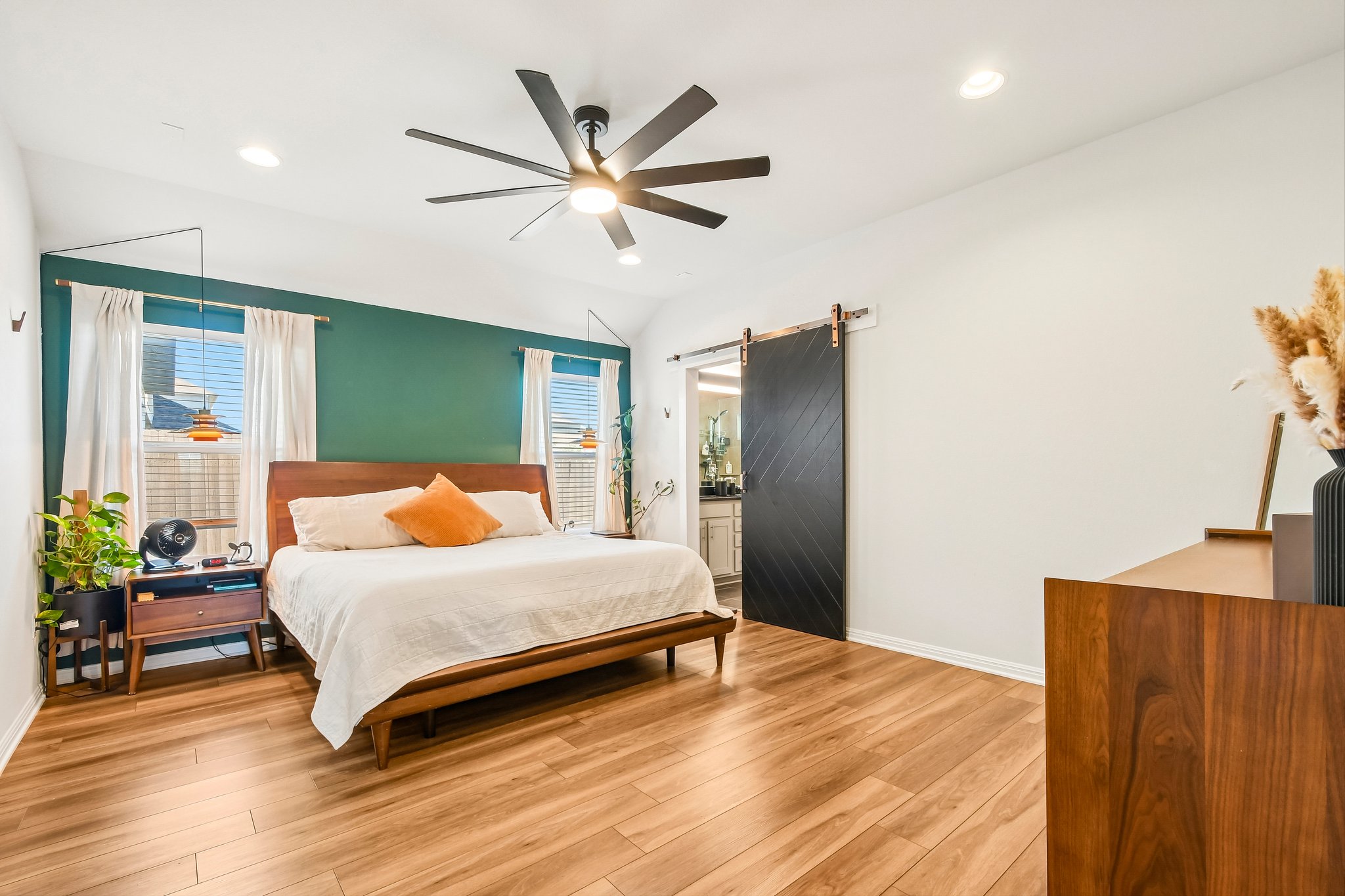 10700 Sentinel Drive Austin, TX 78747 - Photo 4 of 27 The primary suite is spacious and stylish.