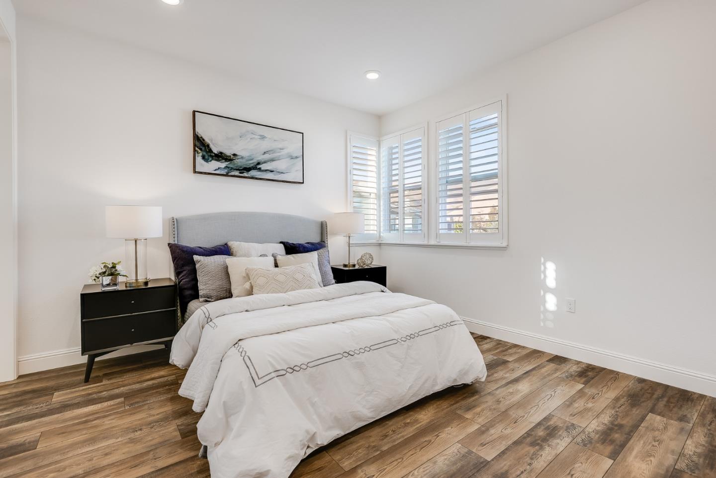 39478 Capstone Common Fremont, CA 94539 - Photo 13 of 33 a bedroom with a bed and wooden floor