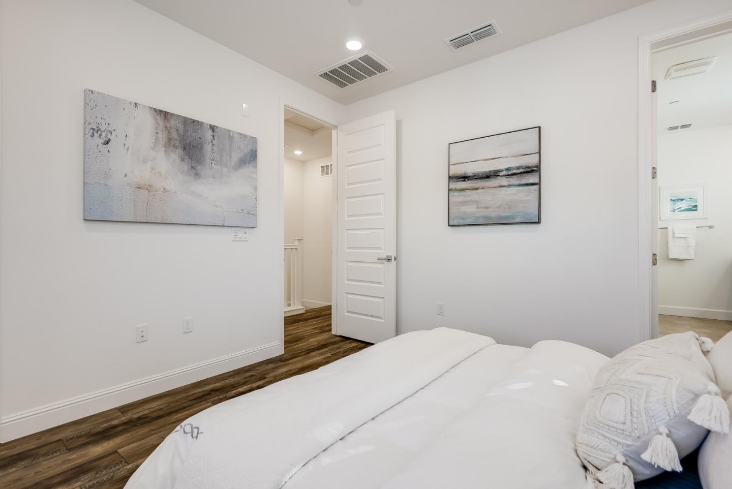 39478 Capstone Common Fremont, CA 94539 - Photo 14 of 33 a bedroom with a bed and a wall painting