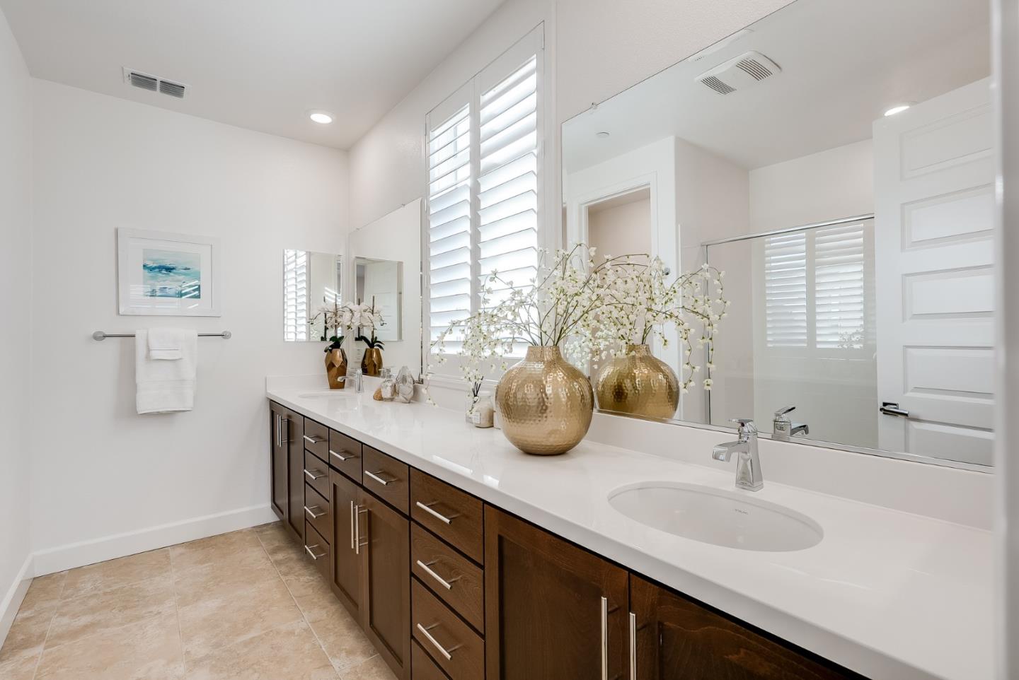 39478 Capstone Common Fremont, CA 94539 - Photo 15 of 33 a bathroom with a double vanity sink and a mirror
