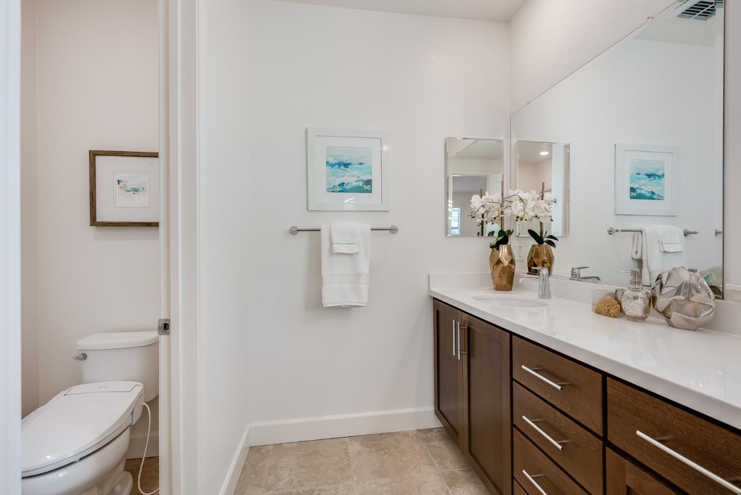 39478 Capstone Common Fremont, CA 94539 - Photo 16 of 33 a bathroom with a sink a toilet and mirror