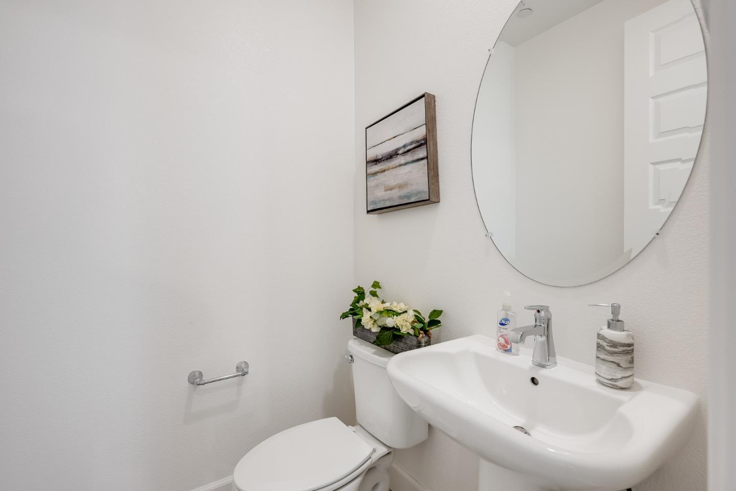 39478 Capstone Common Fremont, CA 94539 - Photo 18 of 33 a bathroom with a sink mirror and toilet