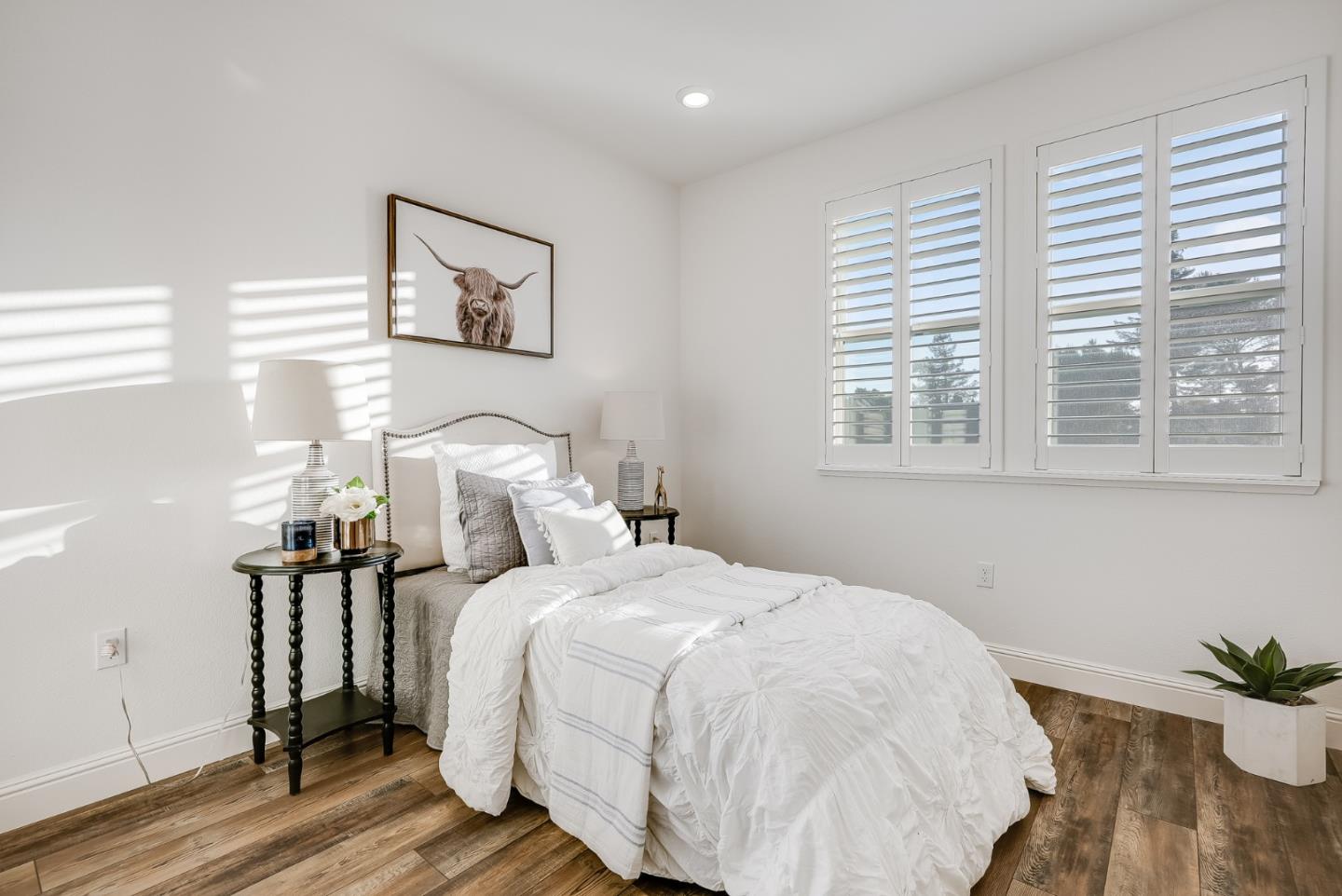 39478 Capstone Common Fremont, CA 94539 - Photo 19 of 33 a bedroom with a bed and wooden floor