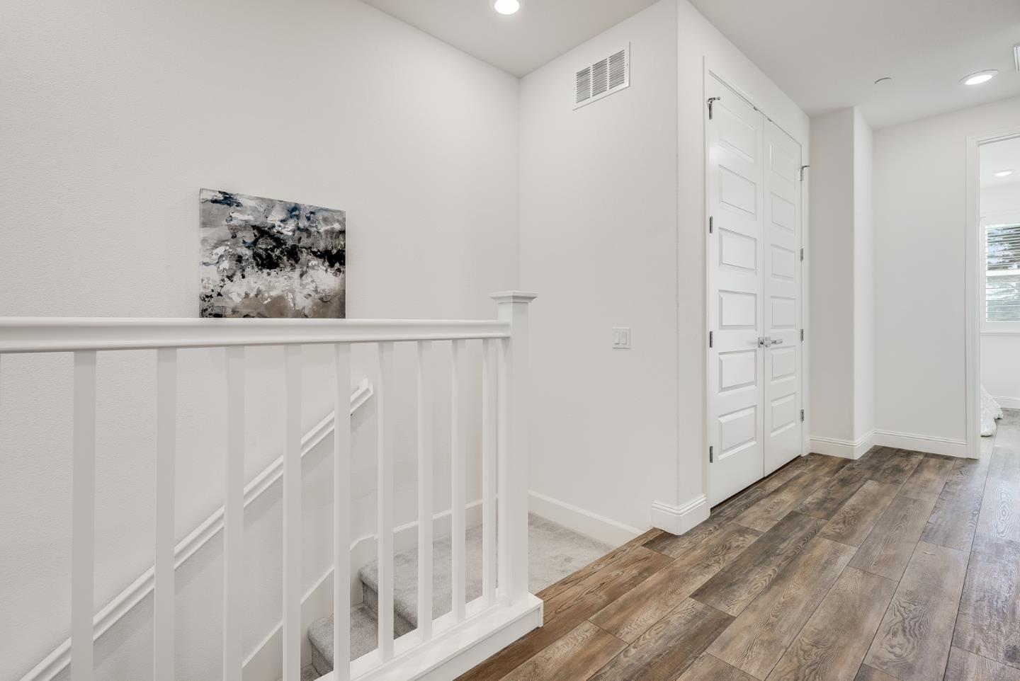 39478 Capstone Common Fremont, CA 94539 - Photo 23 of 33 a view of a hallway with wooden floor and closet