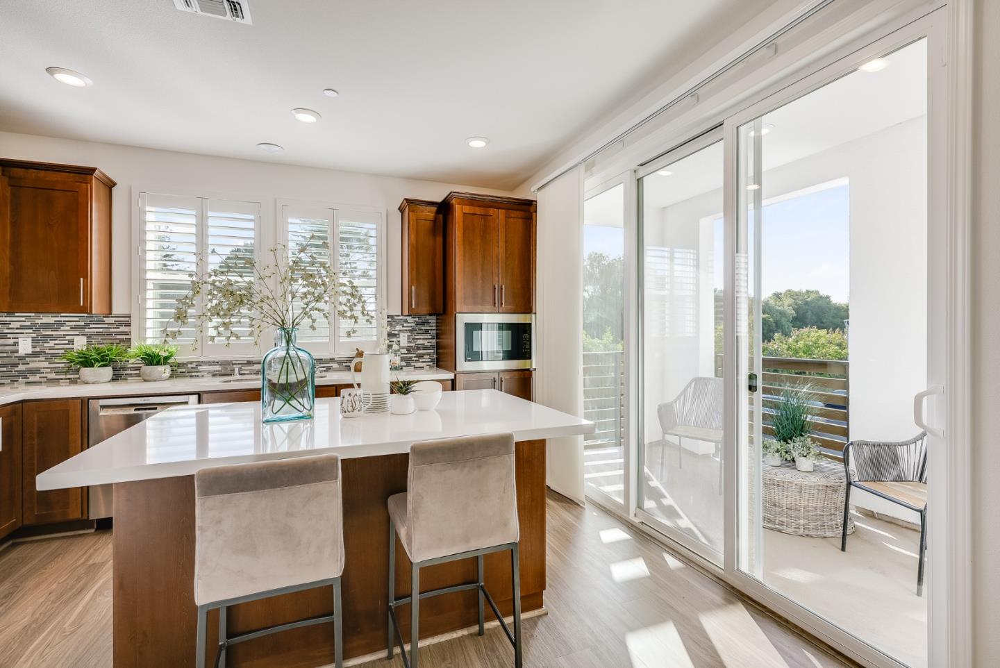 39478 Capstone Common Fremont, CA 94539 - Photo 3 of 33 a large kitchen with kitchen island granite countertop a large window and cabinets