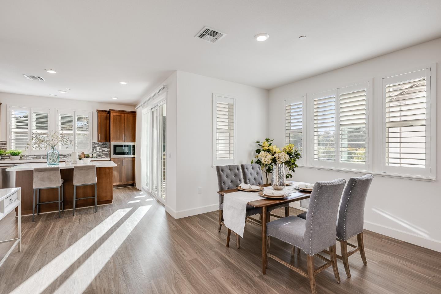 39478 Capstone Common Fremont, CA 94539 - Photo 7 of 33 a dining room with furniture and wooden floor