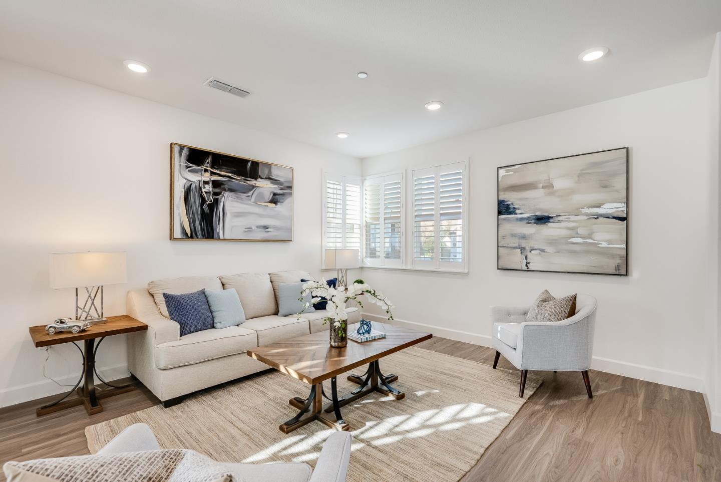 39478 Capstone Common Fremont, CA 94539 - Photo 9 of 33 a living room with furniture and a painting on the wall